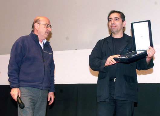 Mohsen Makhmalbaf receiving Honorary Humanitarian Award Thessaloniki film festival Greece 2002